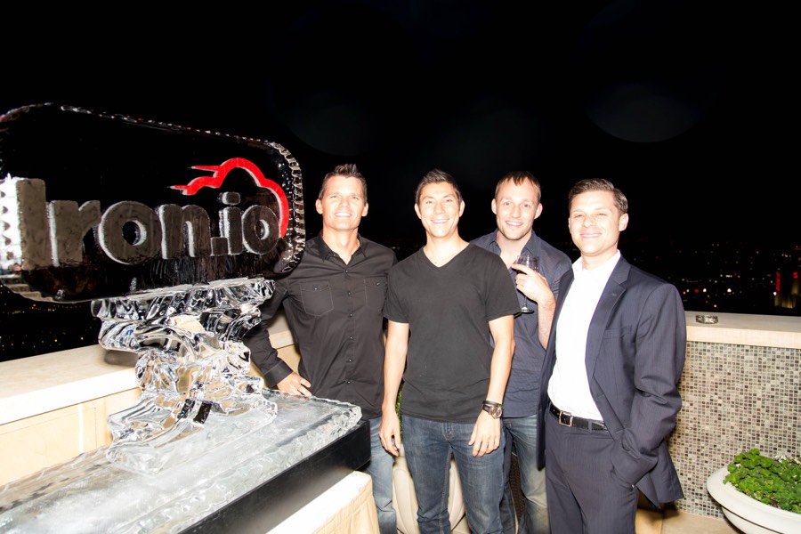 The Iron.io logo carved in ice, overlooking the Las Vegas skyline
